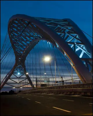 a bridge over a road with a street light at Modern Apartment near Colosseum in Rome
