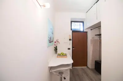 a bathroom with a white counter and a sink at Justa casa Borgo Vittorio in Rome
