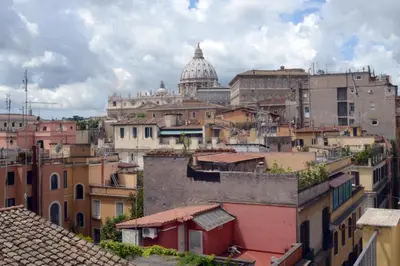 a view of a city with a cathedral in the background at Justa casa Borgo Vittorio in Rome