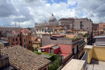 a view of a city with buildings and a cathedral at Justa casa Borgo Vittorio in Rome