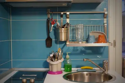 a kitchen counter top with a sink and a sink at La Controra Guesthouse Roma in Rome