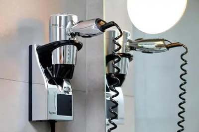 a hair dryer is attached to a wall at Propaganda Suites in Rome
