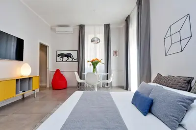 a living room with a couch and a table at Propaganda Suites in Rome