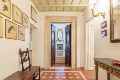 a hallway with a door leading to a bathroom at Campitelli Fascinating Apartment in Rome
