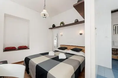 a bedroom with a black and white bed in a room at Al Cedro in Rome