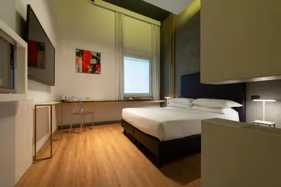 a bedroom with a bed and a window at Maison Pellegrino in Rome