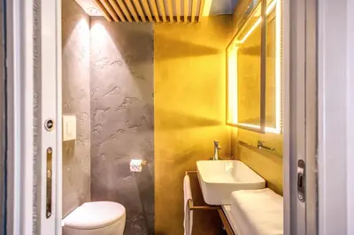 a bathroom with a sink and a toilet at Maison Pellegrino in Rome