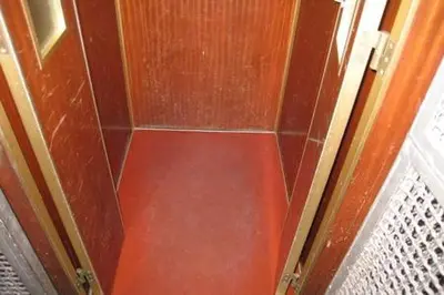 a corner of a room with a red wall at Frattina De Luxe in Rome