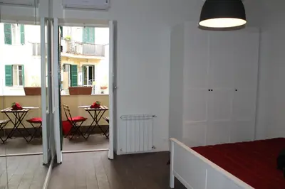 a room with a bed and a table with chairs at Mama Trastevere in Rome