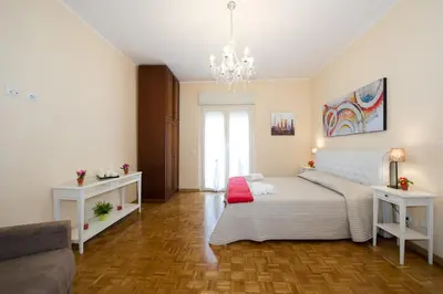 a living room with a bed and a couch at Gregory House in Rome
