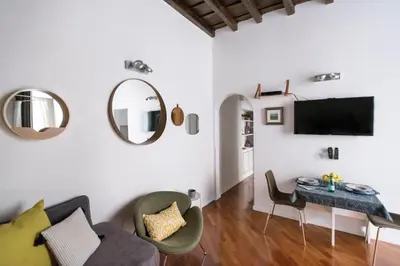 a living room with a couch and a table at Apartment Near Trevi Fountain in Rome