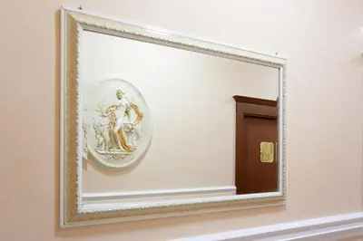 a mirror on a wall in a room at Hotel Suite Caesar in Rome