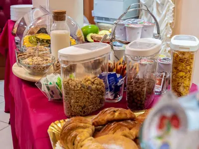 a table with a bunch of different types of food at Hotel Suite Caesar in Rome