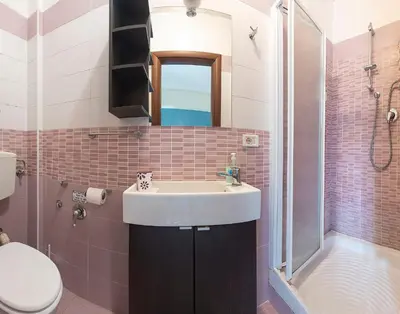 a bathroom with a sink and a shower and a toilet at B&B Zen Trastevere in Rome