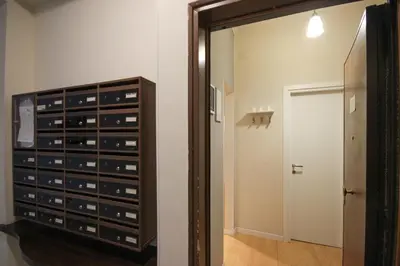 a room with a cabinet filled with wine glasses at Le Piazze di Roma Sweet Apartment in Rome