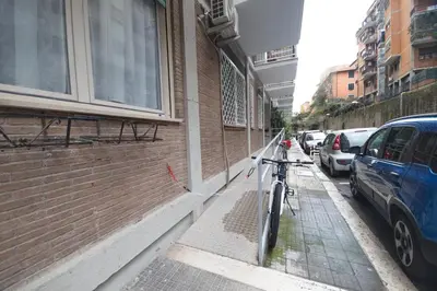 a bike parked on a sidewalk next to a building at Le Piazze di Roma Sweet Apartment in Rome