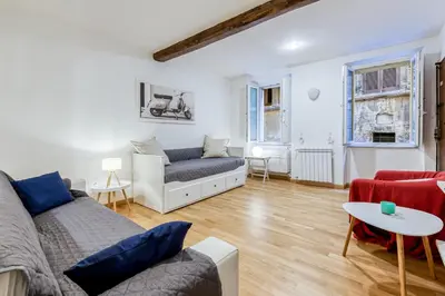 a living room with a couch and a table at Deluxe Apartment - Campo dei Fiori in Rome