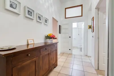 a bathroom with a wooden dresser in a room at Domus Ricca Termini in Rome