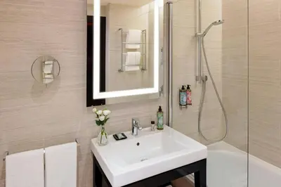 a bathroom with a sink and a shower at Starhotels Michelangelo Rome in Rome