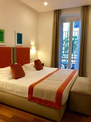 a bedroom with a large bed and a window at 900 Piazza del Popolo in Rome