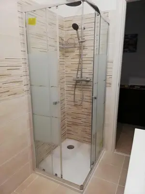 a shower with a glass enclosure in a bathroom at San Pietro & Trastevere Home in Rome