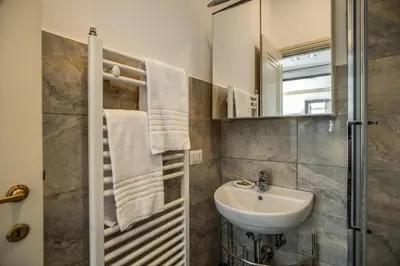 a bathroom with a sink and a mirror at Magia at Colosseum in Rome