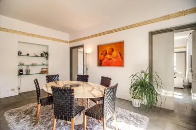 a dining room with a table and chairs at Magia at Colosseum in Rome