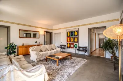 a living room with a couch and a table at Magia at Colosseum in Rome