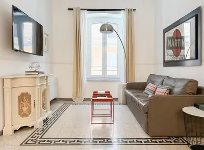 a living room with a couch and a table at Modern Comfort, Poetic Charm in Rome