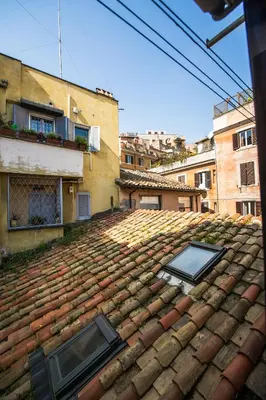 a tile roof with two windows on top of it at Lo Chalet di Trastevere in Rome