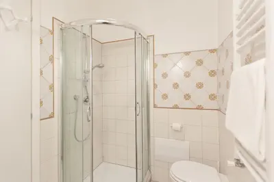 a bathroom with a shower and a toilet at BoRooms in Rome