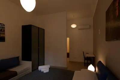a living room with a couch and a table at BoRooms in Rome