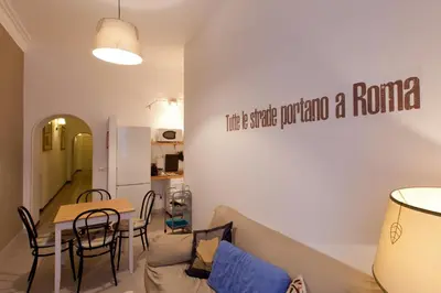 a living room with a couch and a table at BoRooms in Rome