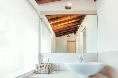 a bathroom with a sink and a mirror at Domizio in Rome