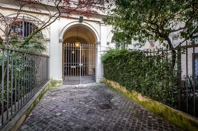 an entrance to a building with a gate and a courtyard at Old Town Apartments Rome in Rome