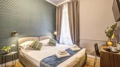 a hotel room with a bed and a window at Charme Spagna Boutique Hotel in Rome