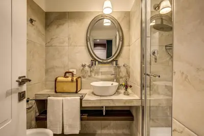 a bathroom with a sink and a mirror at Charme Spagna Boutique Hotel in Rome