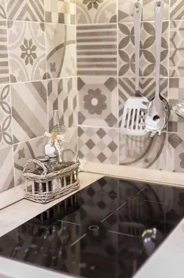a kitchen with a counter top with a tray and utensils at Sweet Life Trevi Roma in Rome