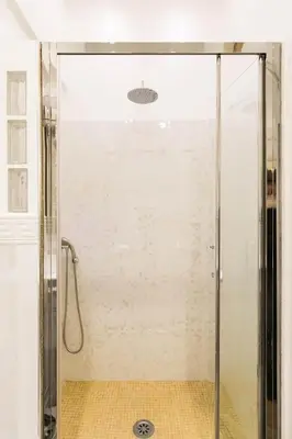 a shower with a glass door in a bathroom at Sweet Life Trevi Roma in Rome