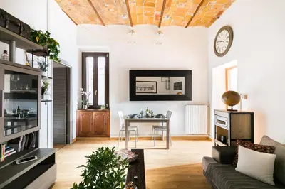 a living room with a couch and a table at Home Domus Borgo Pio - San Pietro in Rome