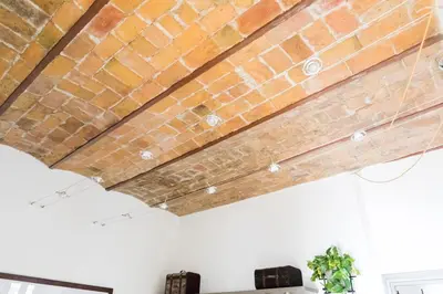 a brick ceiling in a living room at Home Domus Borgo Pio - San Pietro in Rome