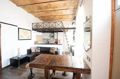a kitchen with a wooden table in a room at Home Domus Borgo Pio - San Pietro in Rome