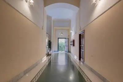 a hallway of a building with a long corridor at Castel Sant Angelo's Harmonious Apartment in Rome