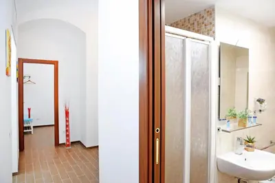 a bathroom with a sink and a glass shower at Castel Sant Angelo's Harmonious Apartment in Rome