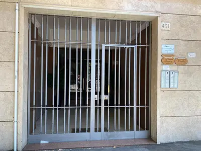 a door with bars on the side of a building at Casa Vacanze Shivon in Rome