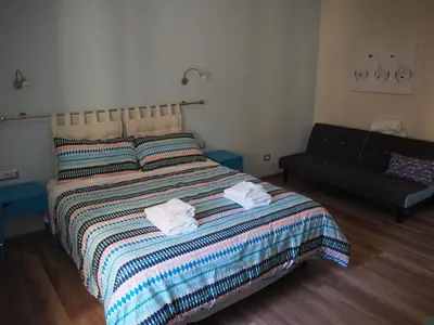 a bedroom with a bed with two towels on it at Bed and Breakfast New Morning Holiday in Rome