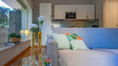 a bedroom with a large bed and a large window at Vatican Park Residence in Rome