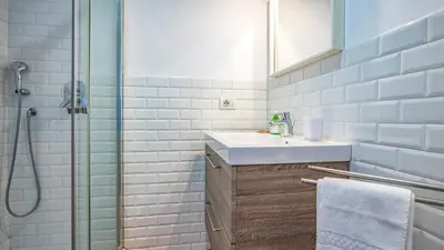 a bathroom with two sinks and a toilet at Vatican Park Residence in Rome