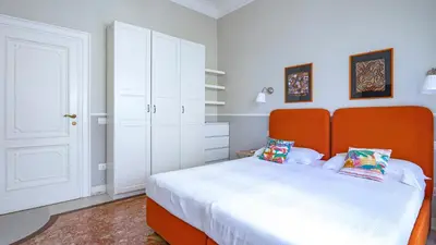 a kitchen and living room with a couch and a table at Vatican Park Residence in Rome