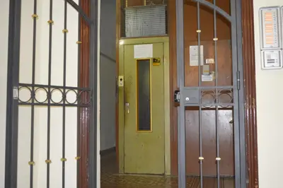 an entrance to a room with a yellow door at Oscar Rooms in Rome